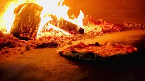 The fire inside a Square Peg wood-fired oven